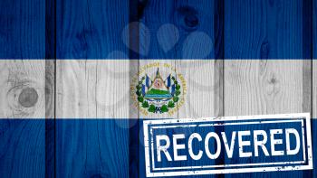 flag of El Salvador that survived or recovered from the infections of corona virus epidemic or coronavirus. Grunge flag with stamp Recovered