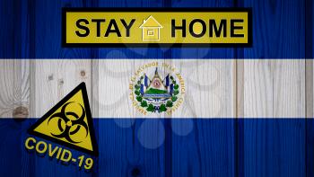 Flag of the El Salvador in original proportions. Quarantine and isolation - Stay at home. flag with biohazard symbol and inscription COVID-19.