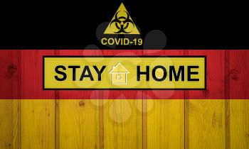Flag of the Germany in original proportions. Quarantine and isolation - Stay at home. flag with biohazard symbol and inscription COVID-19.