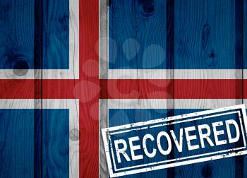flag of Iceland that survived or recovered from the infections of corona virus epidemic or coronavirus. Grunge flag with stamp Recovered