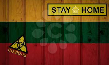 Flag of the Lithuania in original proportions. Quarantine and isolation - Stay at home. flag with biohazard symbol and inscription COVID-19.