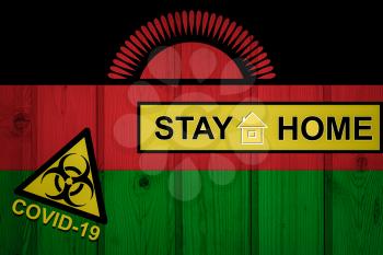 Flag of the Malawi in original proportions. Quarantine and isolation - Stay at home. flag with biohazard symbol and inscription COVID-19.
