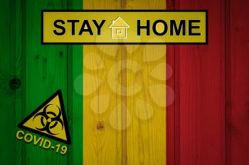 Flag of the Mali in original proportions. Quarantine and isolation - Stay at home. flag with biohazard symbol and inscription COVID-19.
