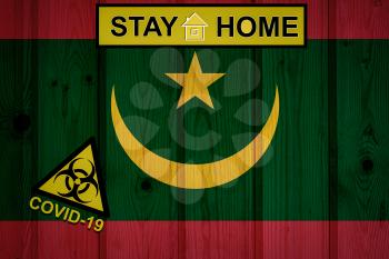 Flag of the Mauritania in original proportions. Quarantine and isolation - Stay at home. flag with biohazard symbol and inscription COVID-19.