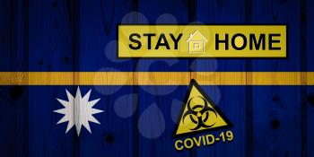 Flag of the Nauru in original proportions. Quarantine and isolation - Stay at home. flag with biohazard symbol and inscription COVID-19.