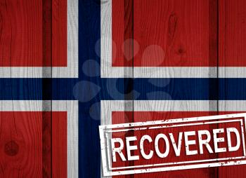 flag of Norway that survived or recovered from the infections of corona virus epidemic or coronavirus. Grunge flag with stamp Recovered
