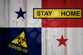 Flag of the Panama in original proportions. Quarantine and isolation - Stay at home. flag with biohazard symbol and inscription COVID-19.