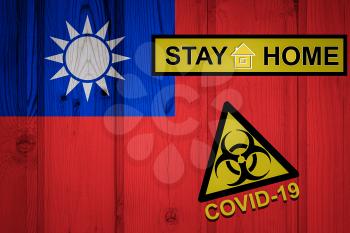 Flag of the Taiwan in original proportions. Quarantine and isolation - Stay at home. flag with biohazard symbol and inscription COVID-19.