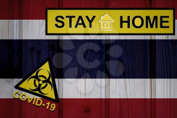 Flag of the Thailand in original proportions. Quarantine and isolation - Stay at home. flag with biohazard symbol and inscription COVID-19.