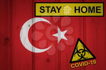 Flag of the Turkey in original proportions. Quarantine and isolation - Stay at home. flag with biohazard symbol and inscription COVID-19.