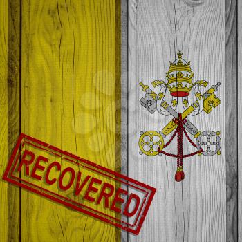 flag of Vatican City that survived or recovered from the infections of corona virus epidemic or coronavirus. Grunge flag with stamp Recovered