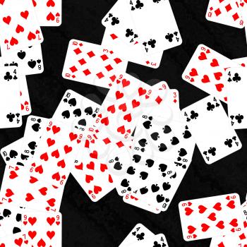 Pile of playing cards on black table.