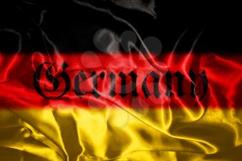 German flag blowing in the wind With Germany Written On It In Gothic Letters
