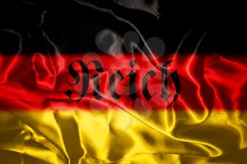 German flag blowing in the wind With Reich Written On It Which Means Realm