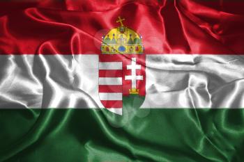 Hungarian National Flag With Coat Of Arms Waving In The Wind Grunge Looking 3D illustration 