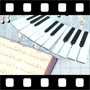 Musical notes appearing over piano and music book