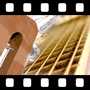 Close-up of a guitar and sheet music