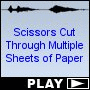 Scissors Cut Through Multiple Sheets of Paper