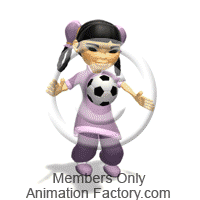 Young girl kicking soccer ball